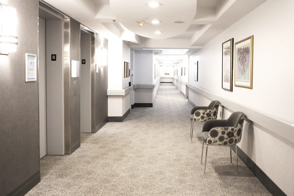 hallway with elevators