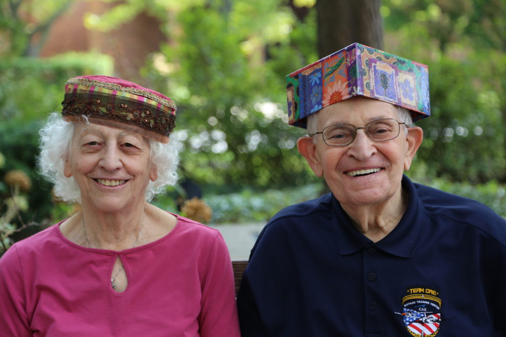 image 7 from hat parade - close up of couple with colourful hats